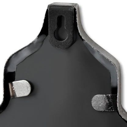 Close-up of a brake pad with metallic and rubber components on a white background