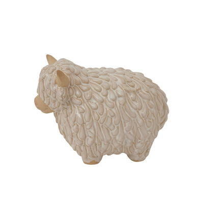 Decorative sheep figurine with textured wool on a white background