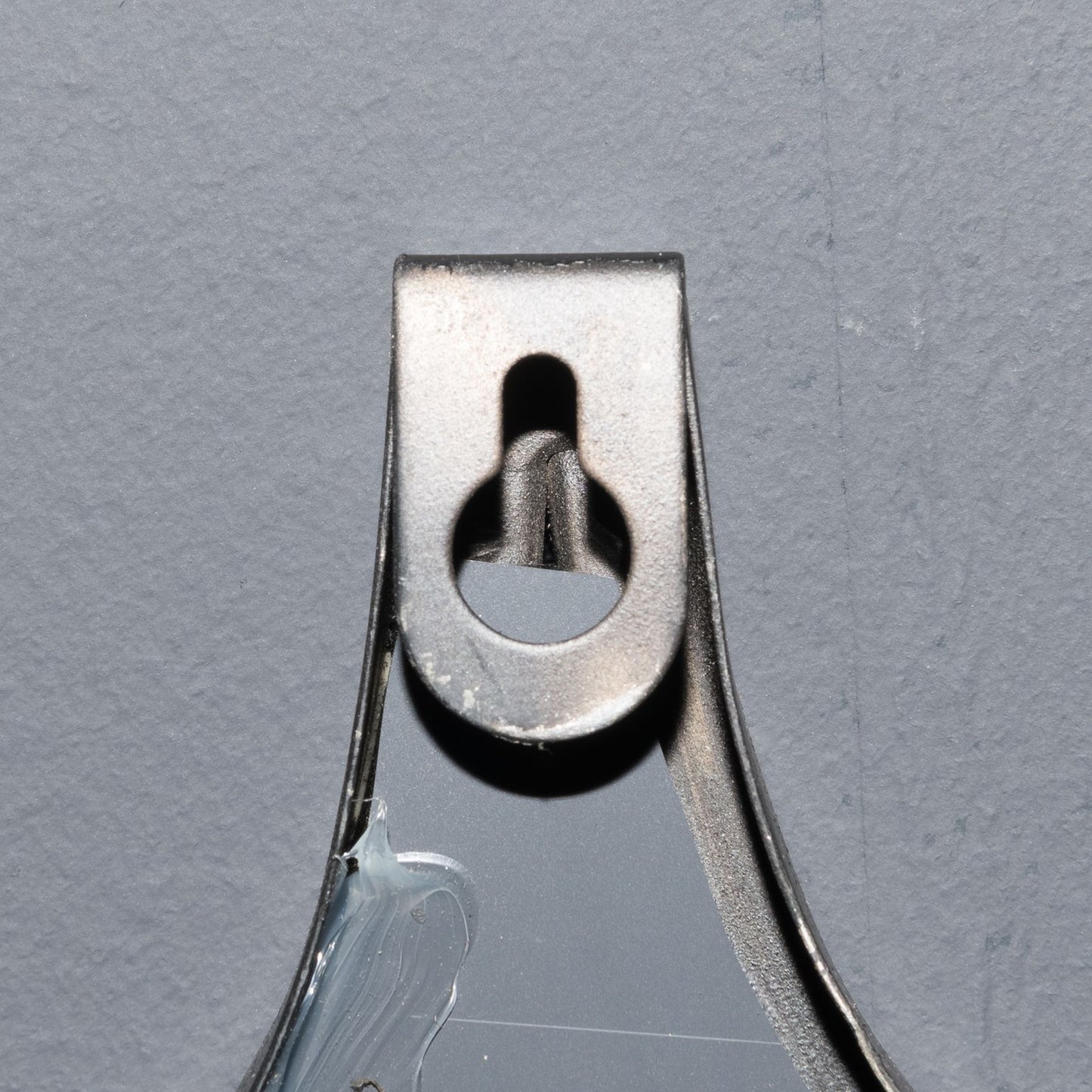 Metallic clip on a gray background