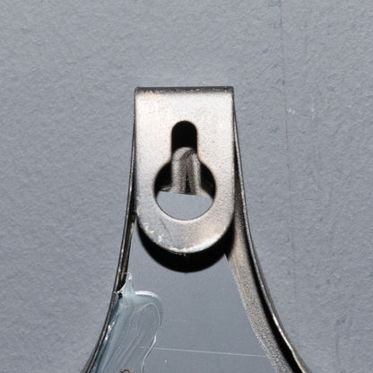 Metallic clip on a gray background