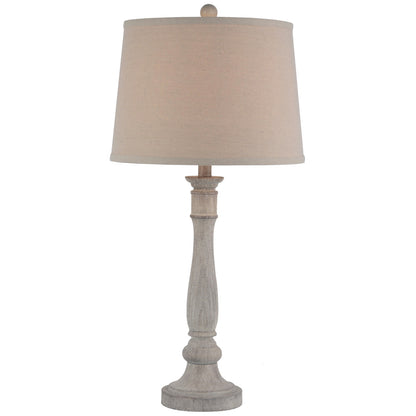 Table lamp with beige shade and wooden base on a white background