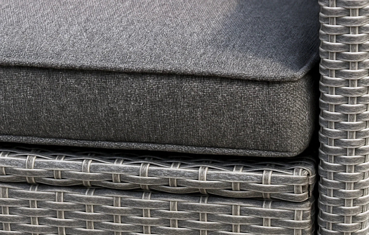 Gray cushions on a wicker outdoor furniture set