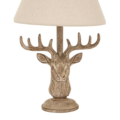 Decorative table lamp with a deer head design on a white background