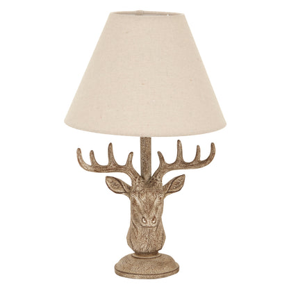 Decorative table lamp with deer head design and beige lampshade on a white background