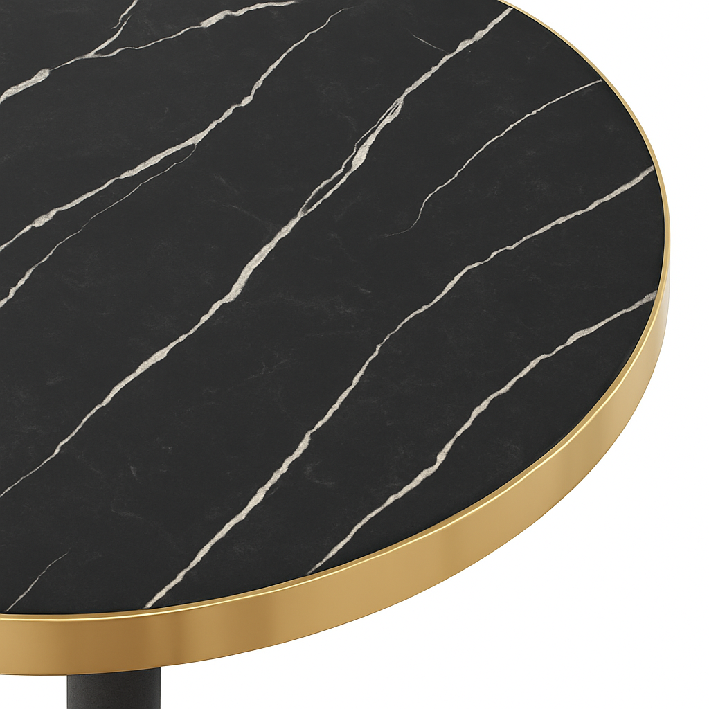 Round table with black marble top and gold rim on a white background