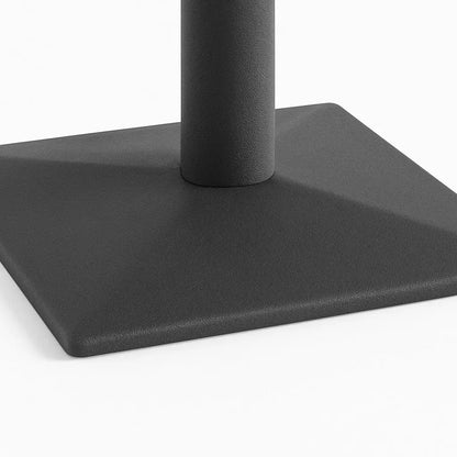 Close-up of a black square base with a cylindrical rod on a white background