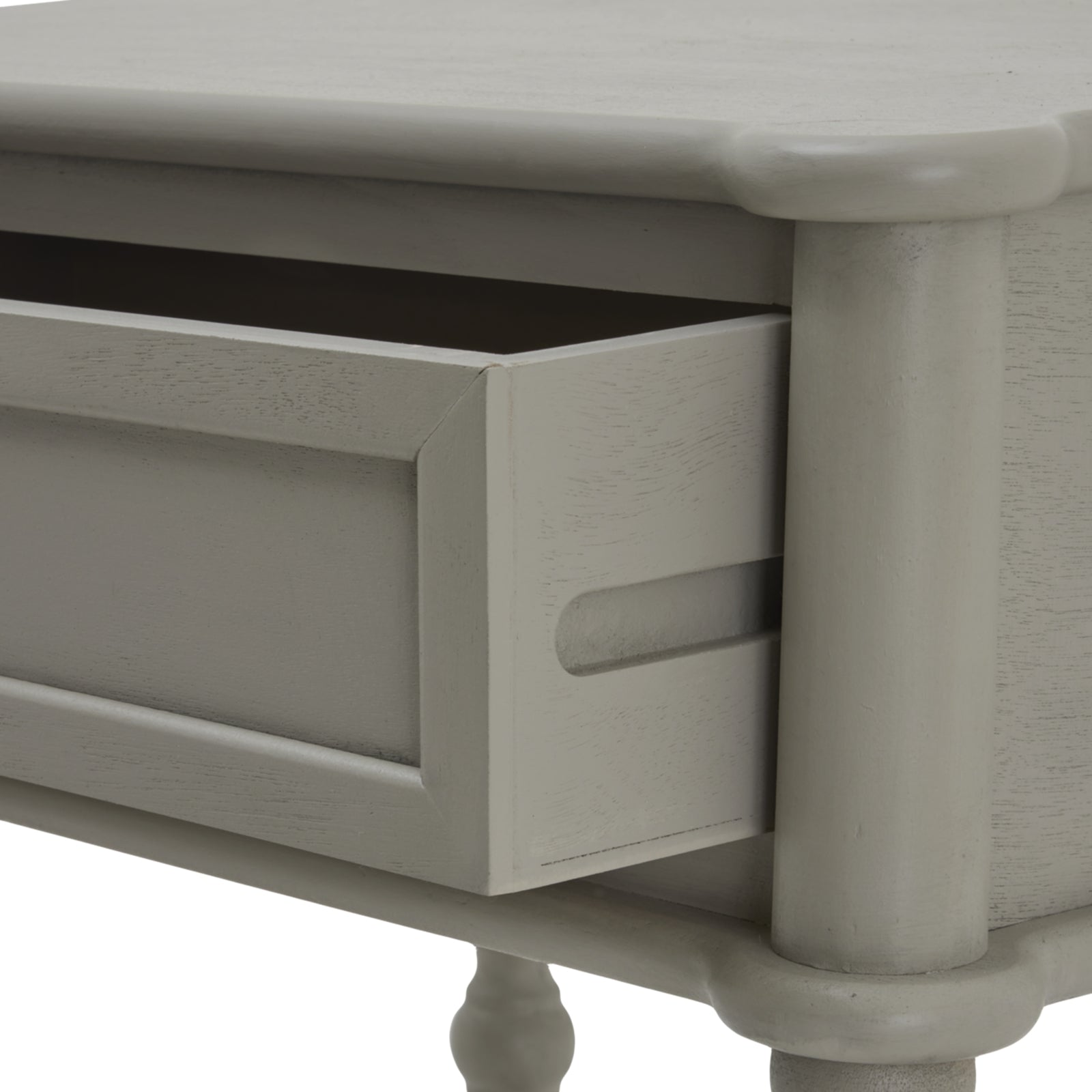 Close-up of a gray wooden drawer with a white background