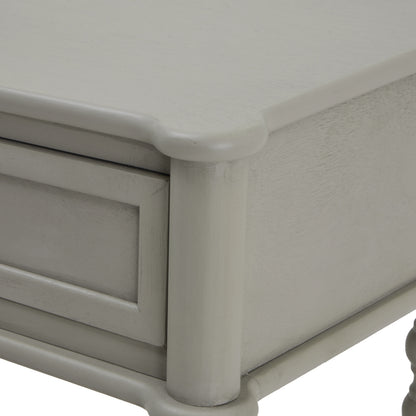 Close-up of a light gray wooden drawer with a smooth finish.