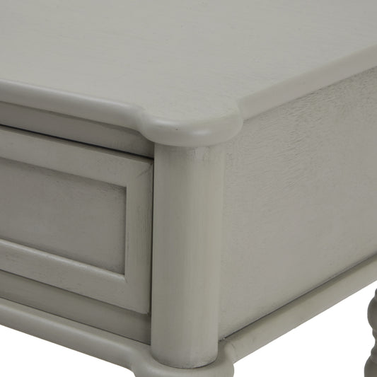 Close-up of a light gray wooden drawer with a smooth finish.