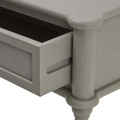 Close-up of a gray wooden side table with a drawer.