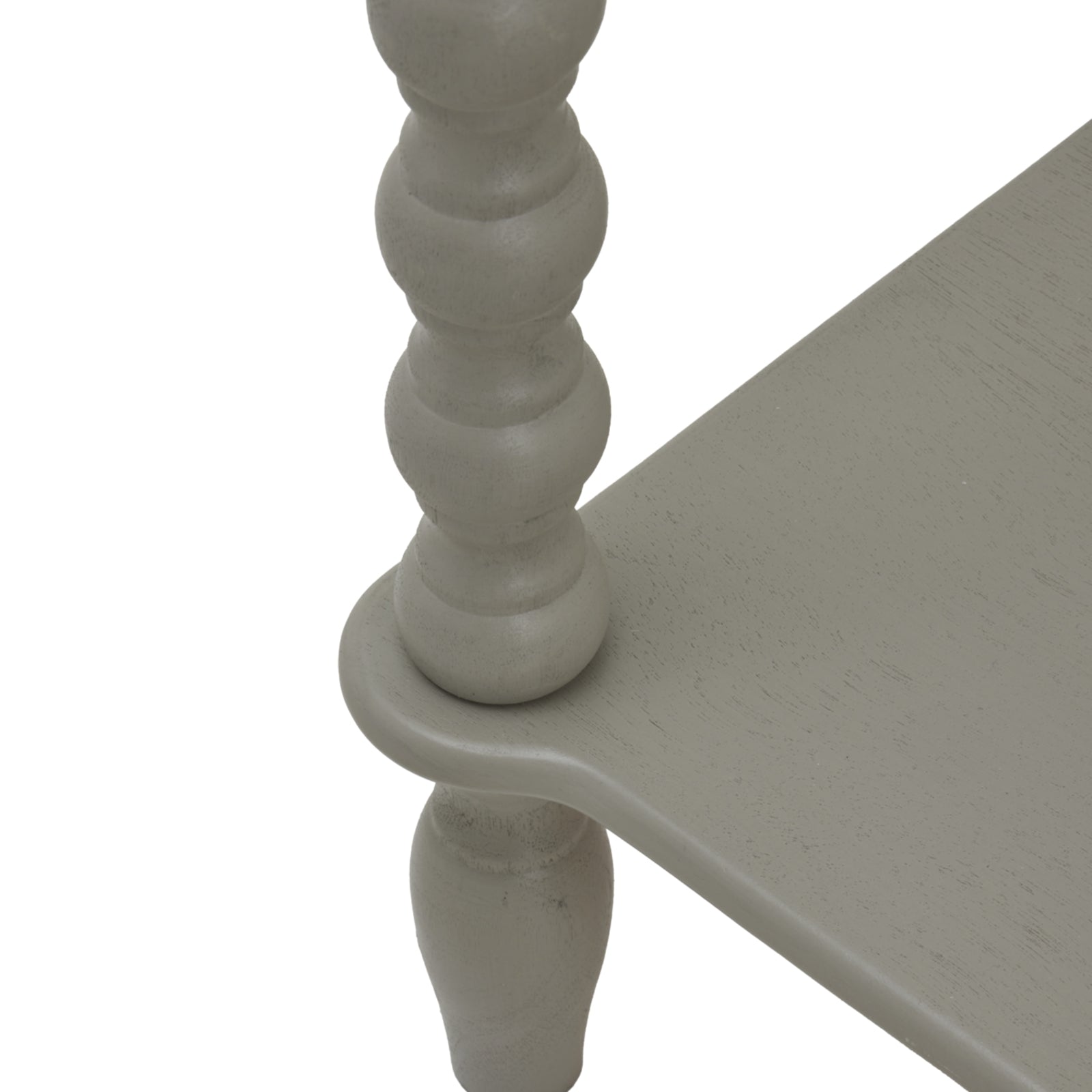 Close-up of a light gray wooden table leg with a white background