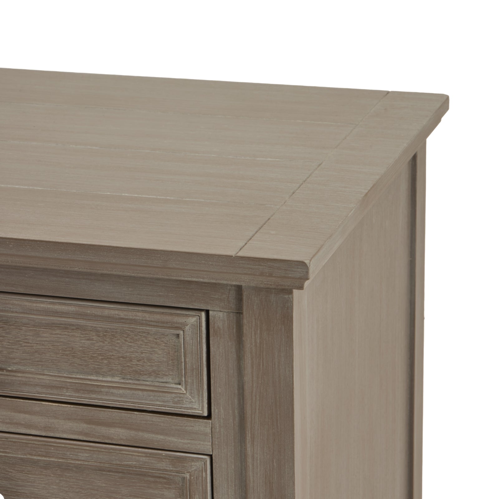 Close-up of a wooden dresser with a light brown finish on a white background