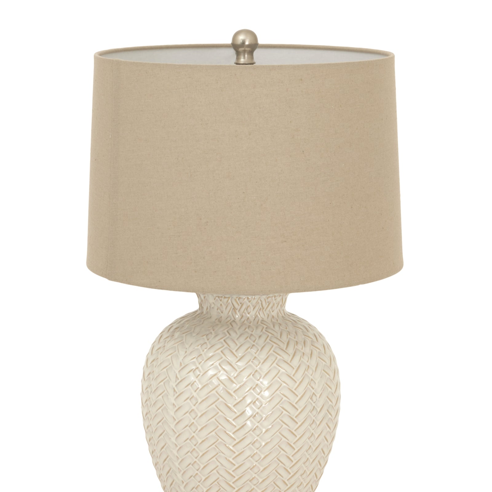 Table lamp with woven base and beige fabric shade on a white background