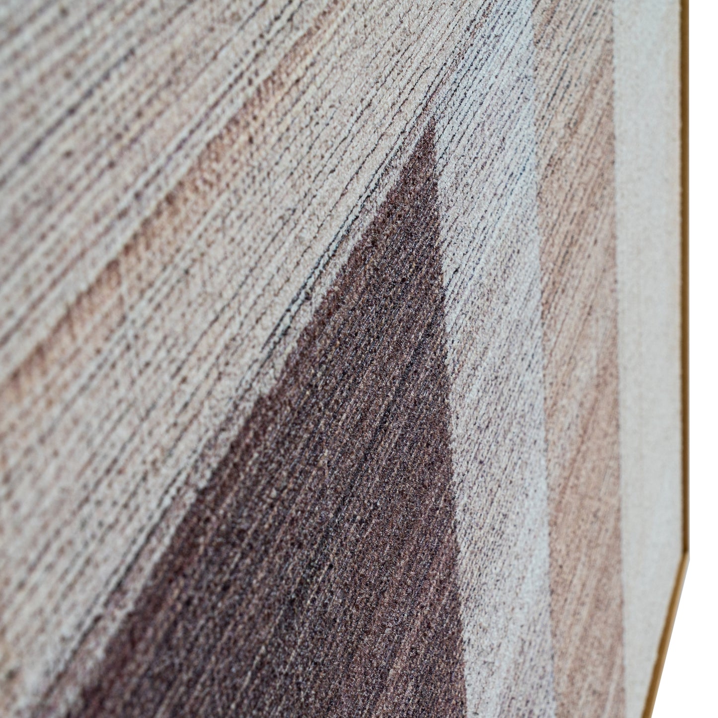 Close-up of a textured fabric with brown, beige, and gray color pattern