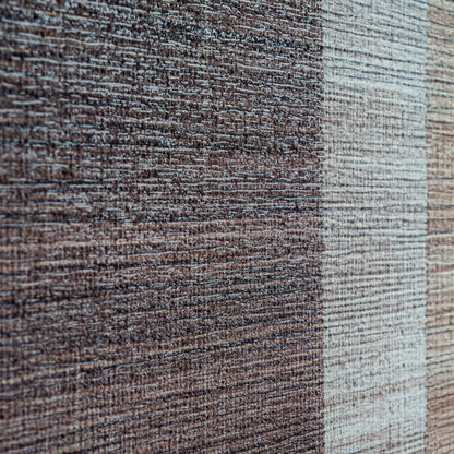 Close-up of a textured fabric with brown and beige colors