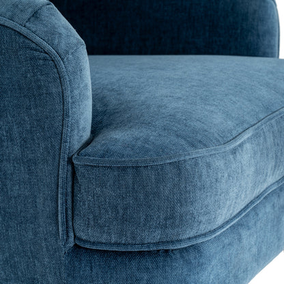 Close-up of a blue upholstered chair with a textured fabric.