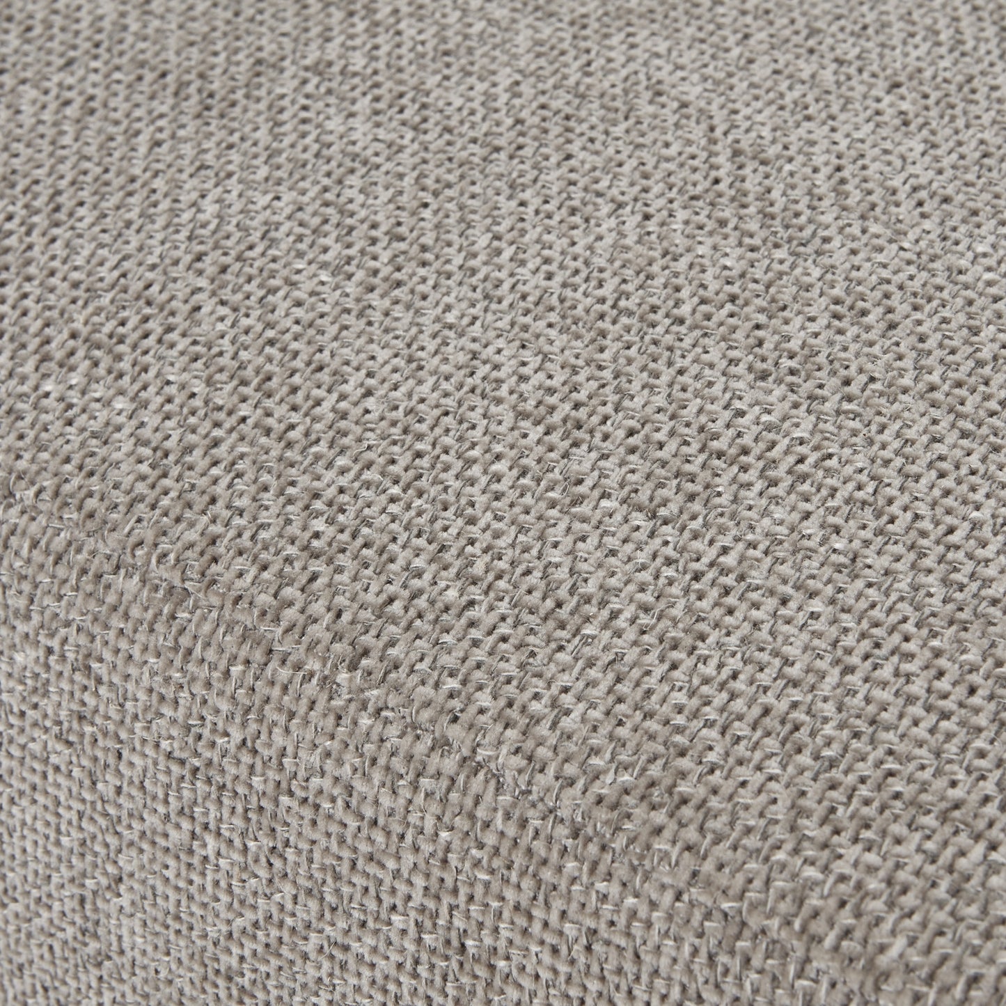 Close-up of a textured beige fabric surface