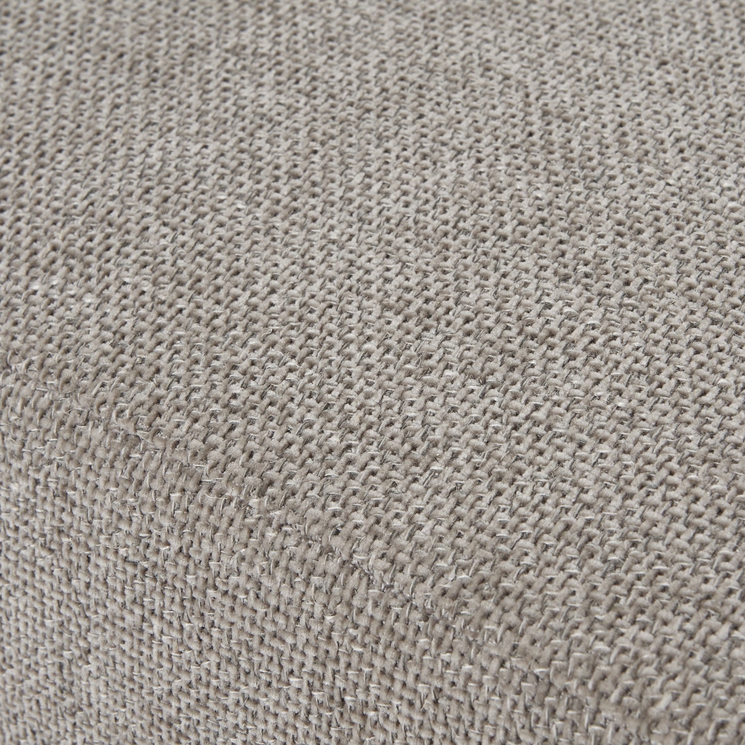 Close-up of a textured beige fabric surface