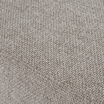 Close-up of a textured beige fabric surface
