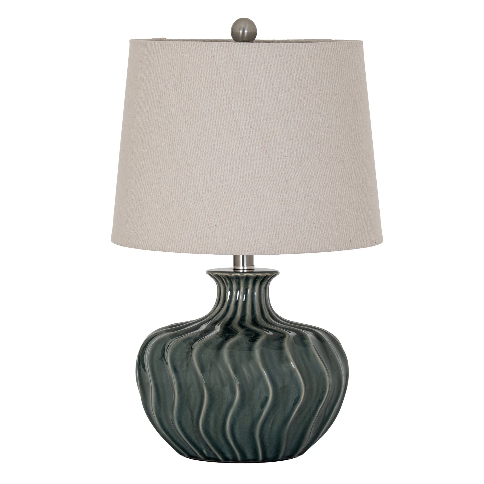 Table lamp with a textured green base and beige lampshade on a white background