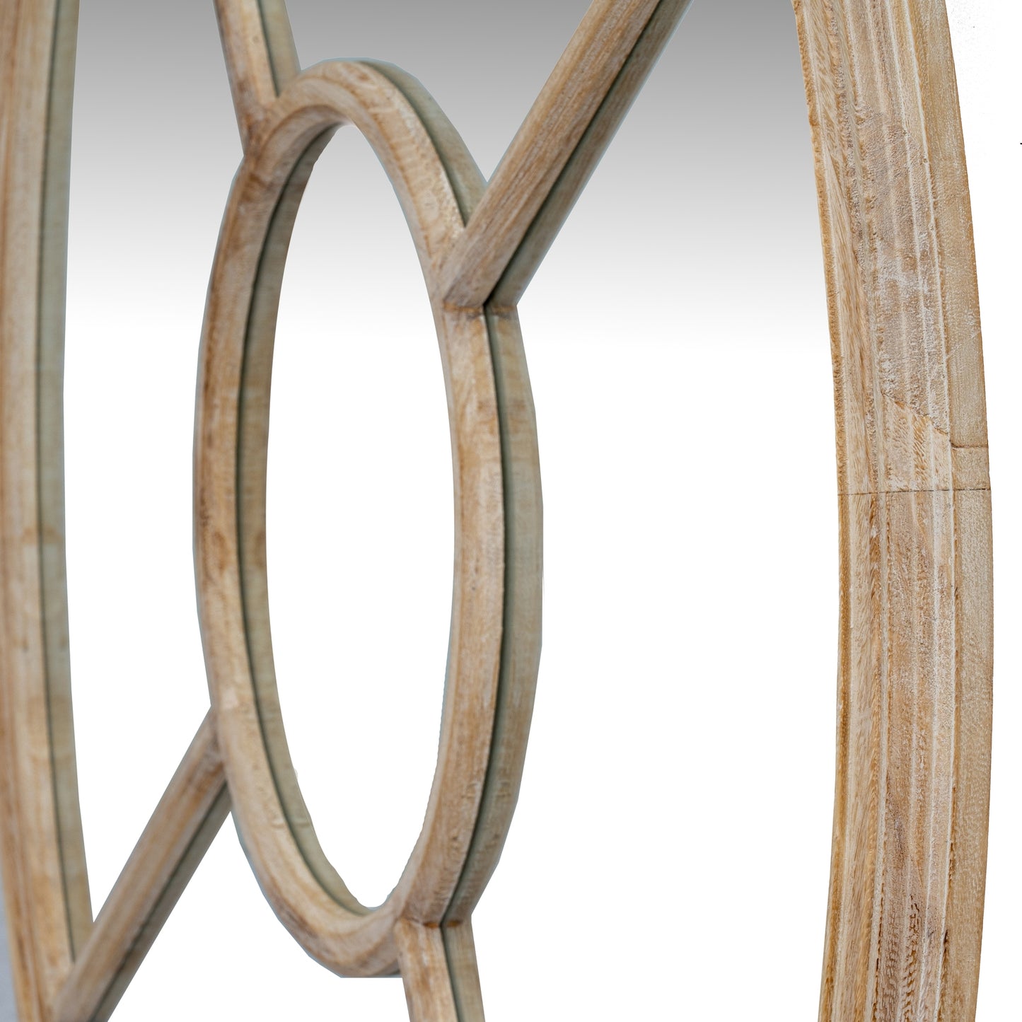 Close-up of wooden circular frames on a white background