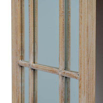 Wooden window frame with glass panes against a light blue wall