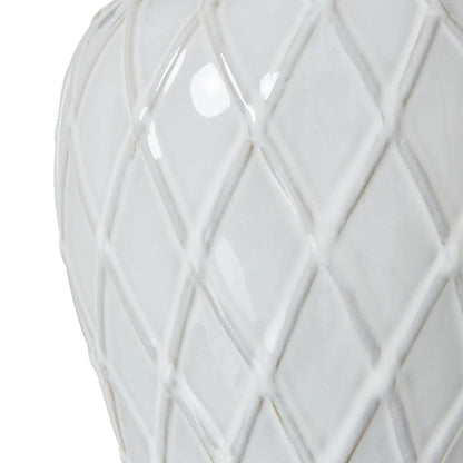 White ceramic vase with geometric lattice pattern on a white background