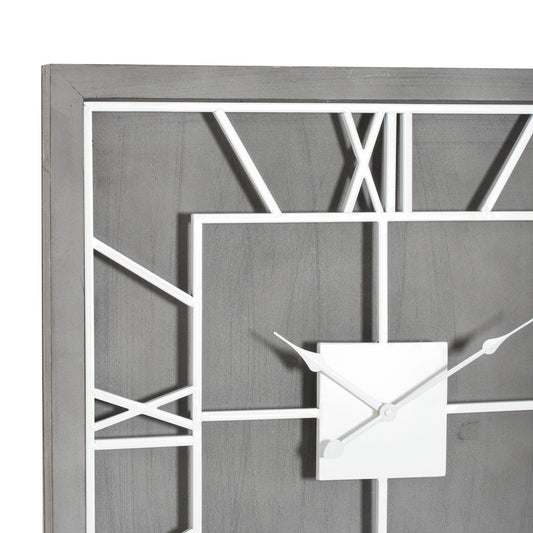 Modern wall clock with geometric design on a gray background