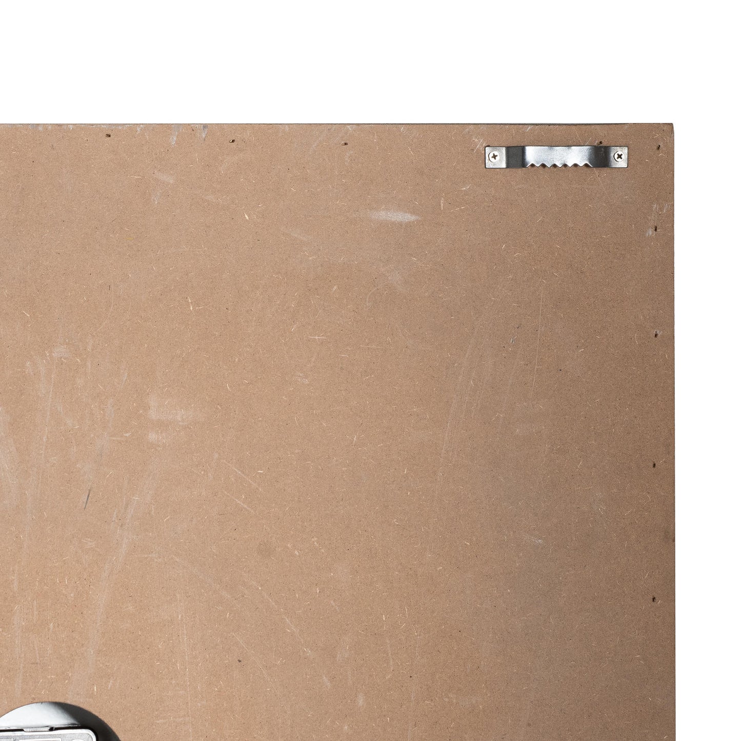 Back of a painting with a signature plate on a beige background