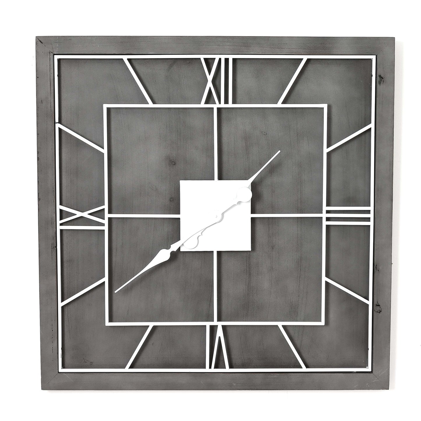 Decorative wall clock with geometric design on a white background