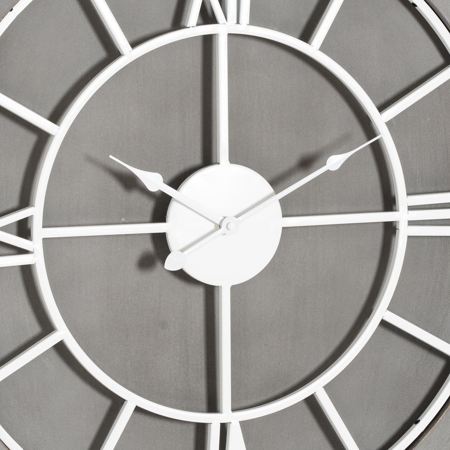 Close-up of a wall clock with a gray background
