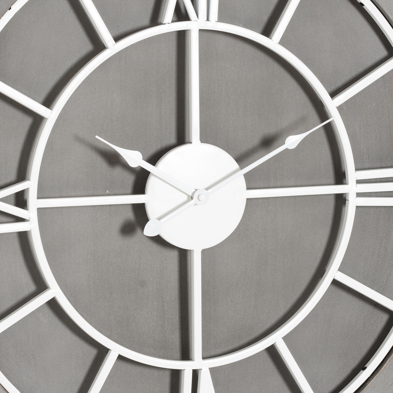 Close-up of a wall clock with a gray background