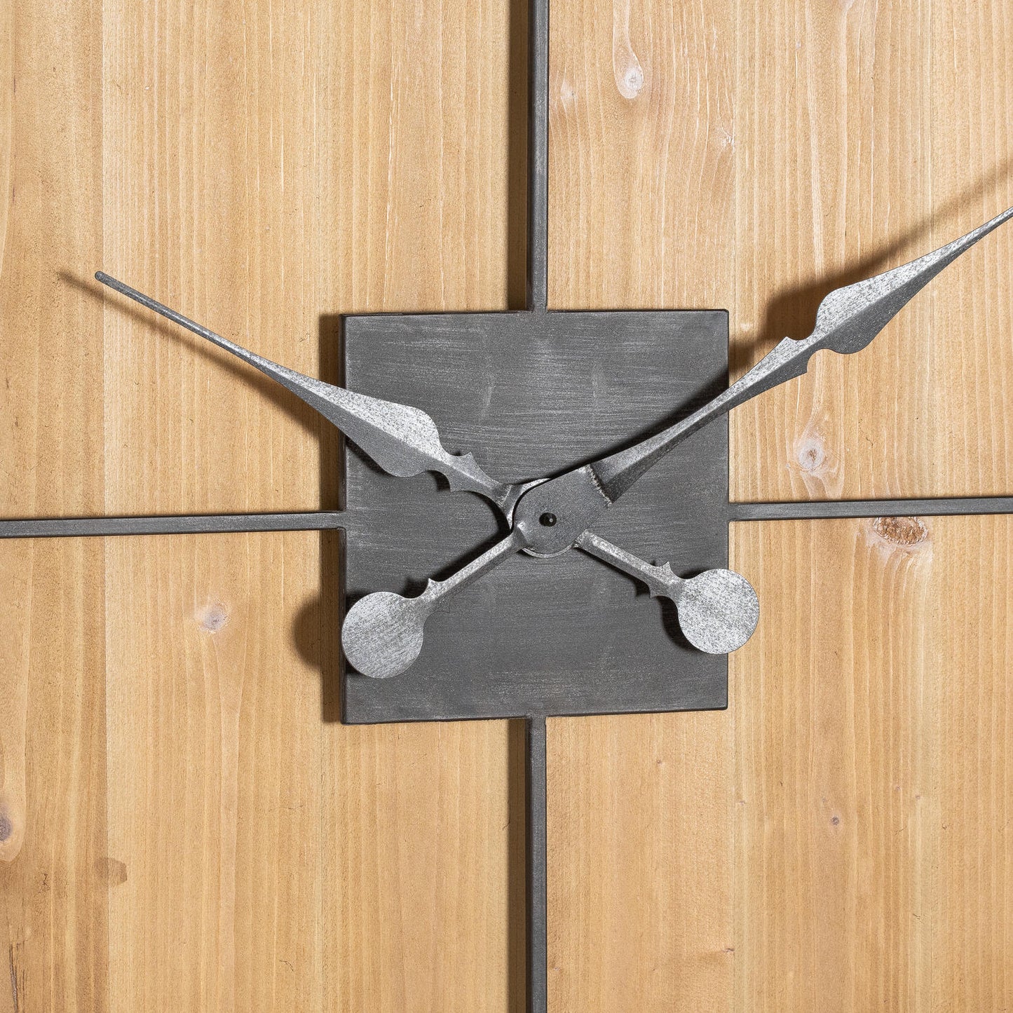 Metallic clock mechanism on a wooden background