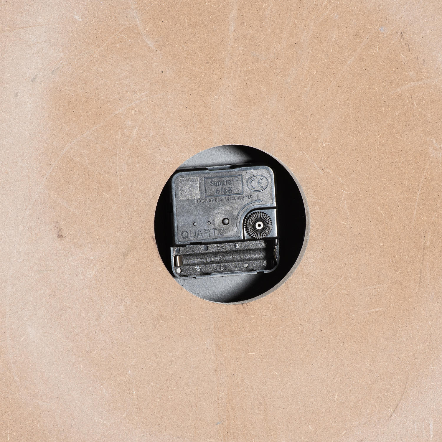 Small vintage camera on a textured beige background