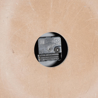 Small vintage camera on a textured beige background