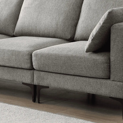 Gray sofa with wooden legs on a neutral background
