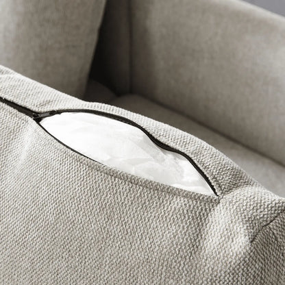 Close-up of a textured beige fabric surface with a zipper
