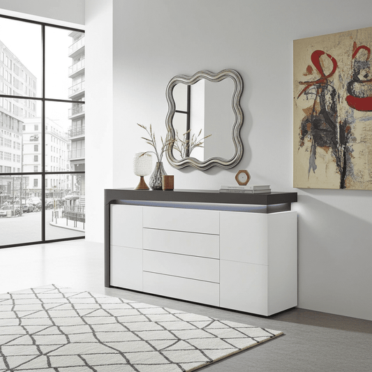 Modern interior with a white dresser, decorative mirror, and abstract painting.