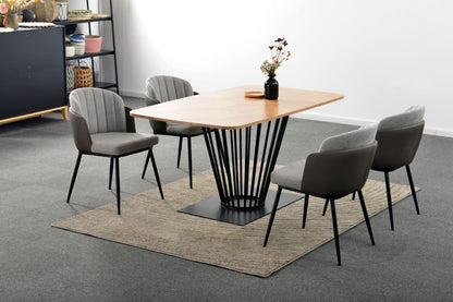 Dining table with four chairs in a modern interior setting