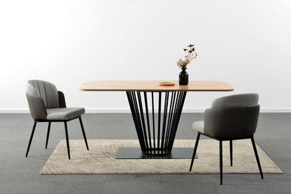 Modern dining table with two chairs on a gray floor and white wall background