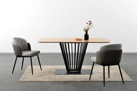 Modern dining table with two chairs on a gray floor and white wall background
