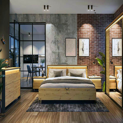 Modern bedroom with wooden furniture, brick wall, and large windows.