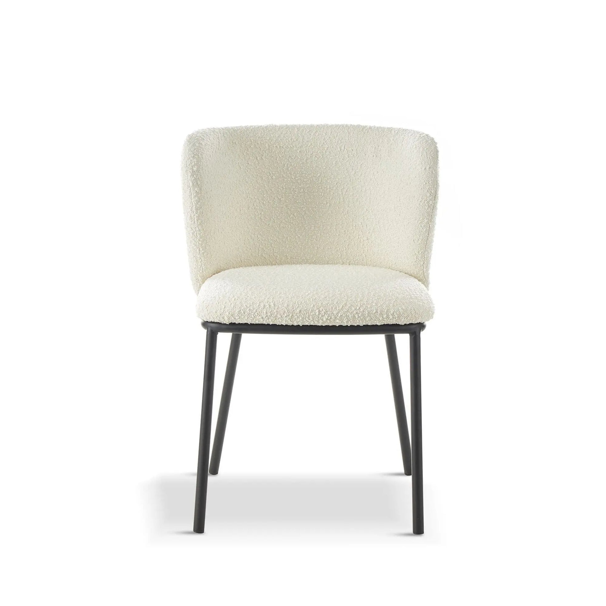 White upholstered chair with black legs on a white background