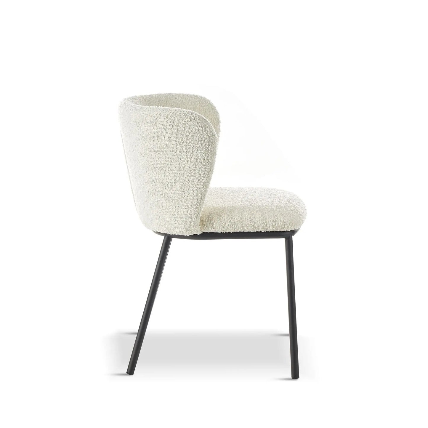 White upholstered chair with black legs on a white background
