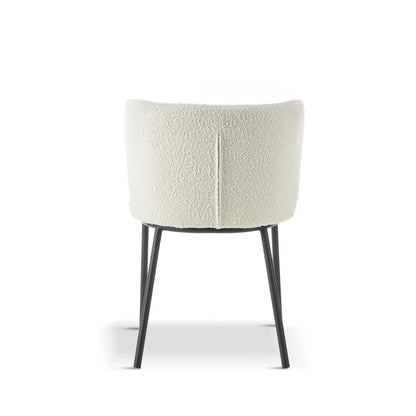 Chair with white textured backrest and black legs on a white background